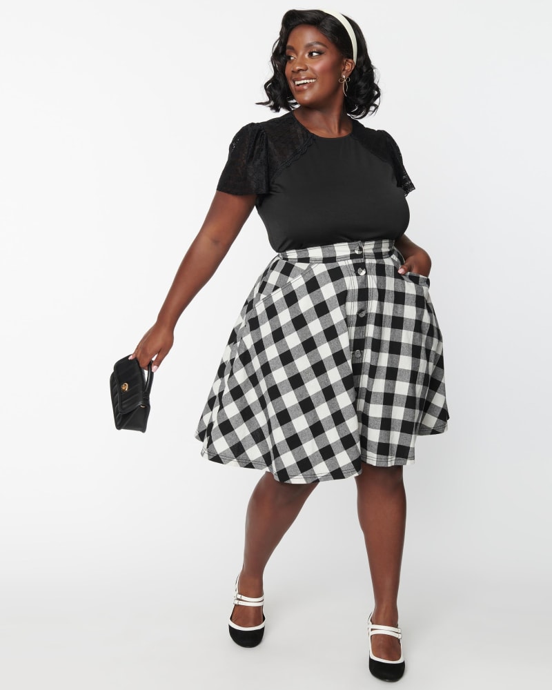 Front of a model wearing a size 3X/20 Unique Vintage Plus Size Black & White Gingham Swing Skirt in Black & White Gingham by Unique Vintage. | dia_product_style_image_id:269853